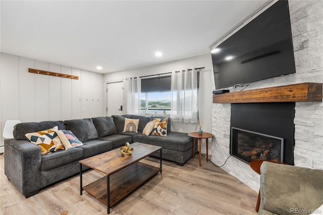 370 E Ln Bonte St Unit 502, Dillon, CO 80435 - living area featuring wood finished floors, a stone fireplace, and recessed lighting
