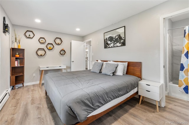 370 E Ln Bonte St Unit 502, Dillon, CO 80435 - bedroom featuring light wood-style flooring, recessed lighting, baseboard heating, and baseboards