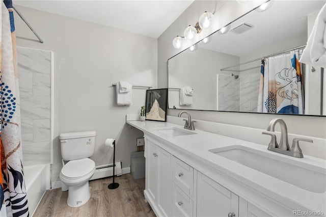 370 E Ln Bonte St Unit 502, Dillon, CO 80435 - full bath featuring wood finished floors, toilet, baseboard heating, double vanity, and shower / tub combo