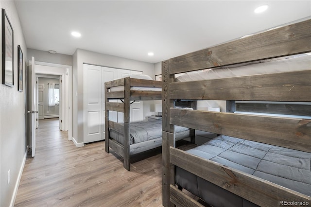 370 E Ln Bonte St Unit 502, Dillon, CO 80435 - unfurnished bedroom featuring baseboards, light wood-style flooring, a baseboard radiator, and recessed lighting