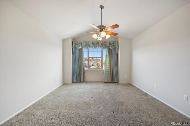 unfurnished room with ceiling fan, lofted ceiling, and carpet