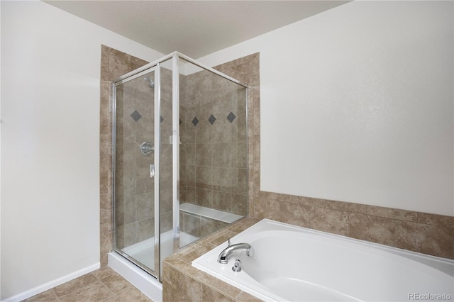 bathroom featuring tile patterned floors and shower with separate bathtub