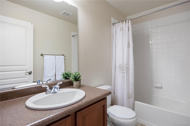 full bathroom featuring shower / bath combination with curtain, vanity, and toilet