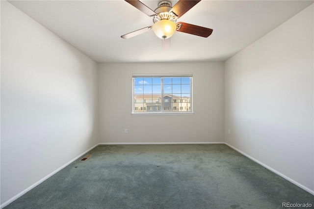 empty room featuring carpet flooring and ceiling fan