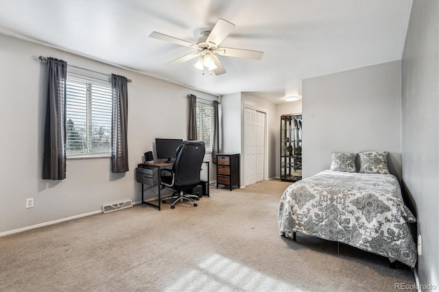 bedroom featuring visible vents, baseboards, carpet, and ceiling fan