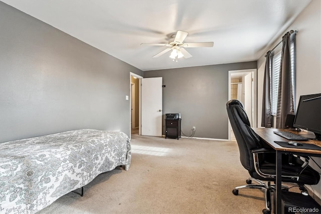 bedroom featuring light colored carpet, baseboards, and ceiling fan