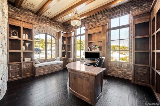 office featuring brick wall, dark hardwood / wood-style floors, and beam ceiling