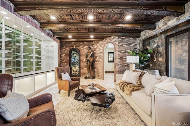 interior space featuring beamed ceiling and brick wall