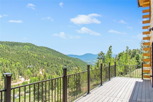 wooden deck featuring a mountain view