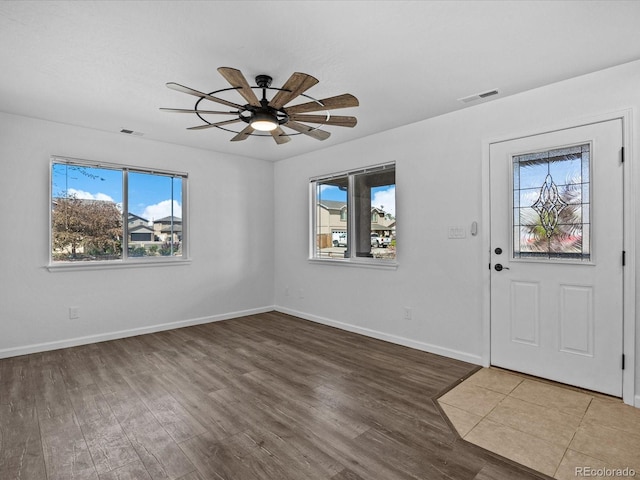 foyer featuring wood finished floors, visible vents, and a wealth of natural light