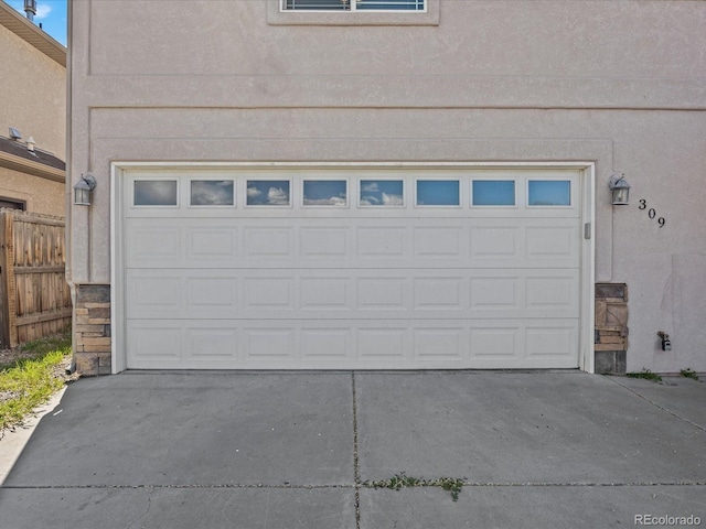 garage with concrete driveway
