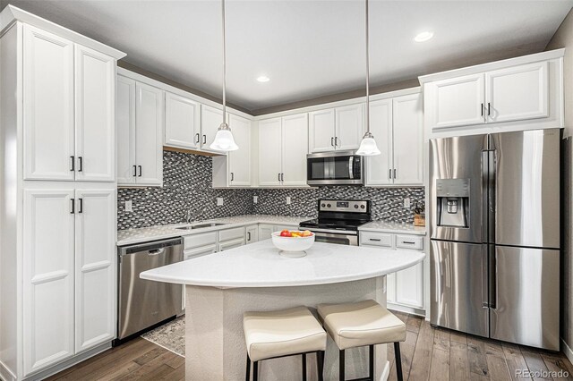 10066 Belvedere Cir, Lone Tree, CO 80124 - kitchen with white cabinetry, dark wood-style flooring, stainless steel appliances, and a sink