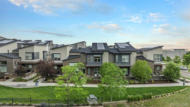 10066 Belvedere Cir, Lone Tree, CO 80124 - view of front of property featuring stucco siding, a residential view, and solar panels