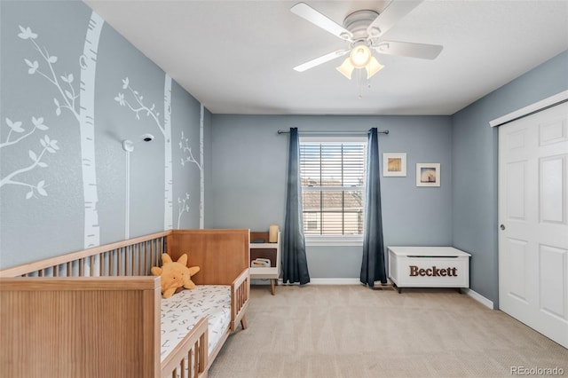bedroom featuring baseboards, ceiling fan, and carpet flooring