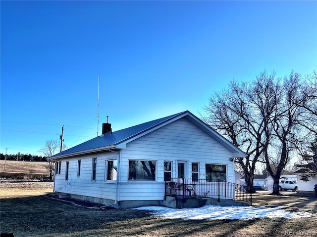 view of front of property with a chimney