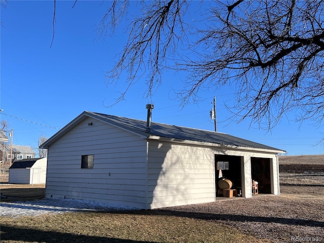 view of home's exterior featuring an outdoor structure