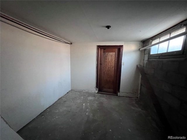 interior space with unfinished concrete floors