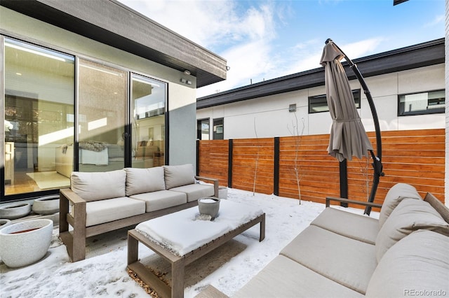 view of patio with an outdoor living space and fence