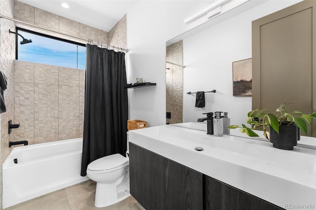 full bathroom featuring vanity, toilet, shower / bath combo with shower curtain, and tile patterned flooring