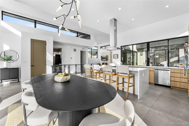 dining space with recessed lighting and finished concrete flooring