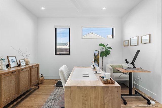 office area with recessed lighting, baseboards, and light wood-style floors