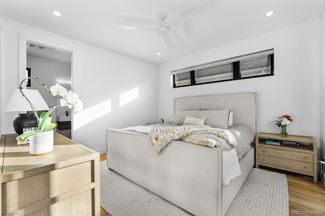 bedroom featuring recessed lighting, wood finished floors, and a ceiling fan