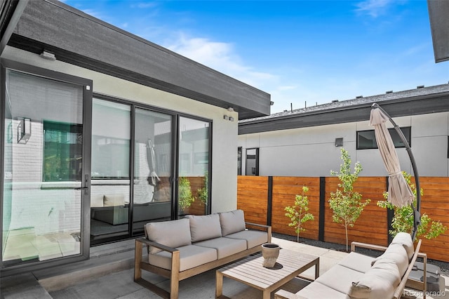 view of patio with fence and an outdoor living space
