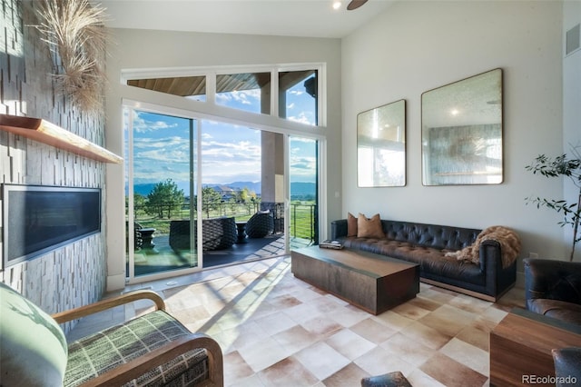 3585 Meadow Run Cir, Colorado Springs, CO 80908 - living area with tile patterned floors and a high ceiling