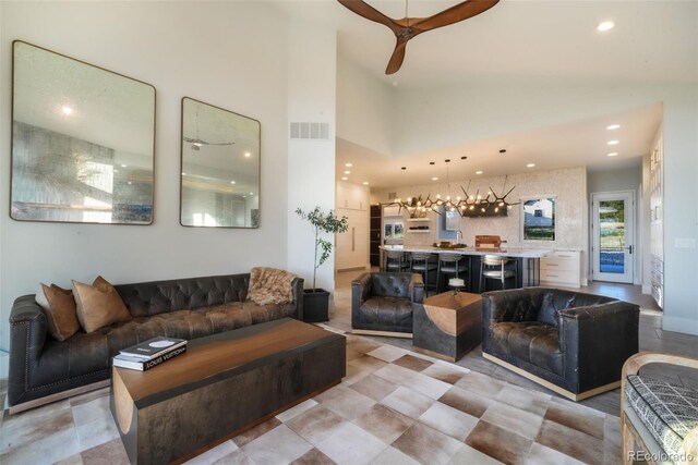 3585 Meadow Run Cir, Colorado Springs, CO 80908 - living area with recessed lighting, ceiling fan, high vaulted ceiling, and a chandelier