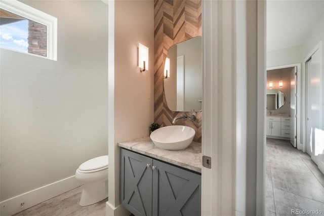 3585 Meadow Run Cir, Colorado Springs, CO 80908 - bathroom featuring vanity, tasteful backsplash, and toilet
