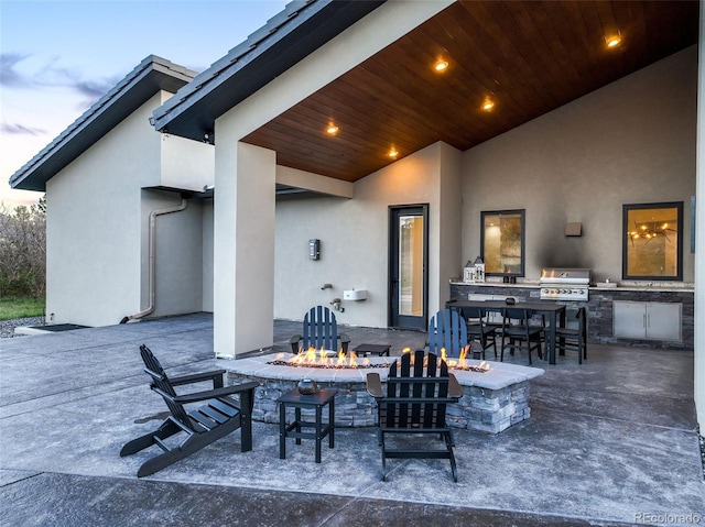 3585 Meadow Run Cir, Colorado Springs, CO 80908 - view of patio / terrace featuring an outdoor fire pit, a grill, and exterior kitchen