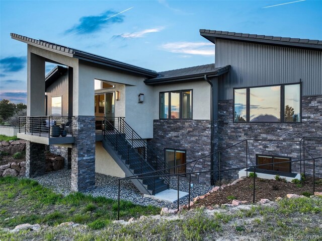 3585 Meadow Run Cir, Colorado Springs, CO 80908 - view of front of house featuring stone siding, stucco siding, and stairway