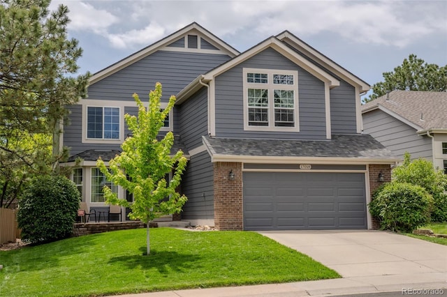 17018 Carr Ave, Parker, CO 80134 - view of front of property with driveway, brick siding, a front yard, an attached garage, and a shingled roof