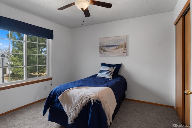 17018 Carr Ave, Parker, CO 80134 - bedroom with carpet, baseboards, a ceiling fan, a textured ceiling, and a closet