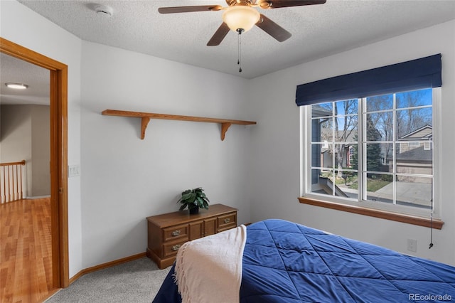17018 Carr Ave, Parker, CO 80134 - bedroom featuring a textured ceiling, a ceiling fan, and baseboards
