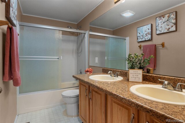 17018 Carr Ave, Parker, CO 80134 - full bath with toilet, double vanity, enclosed tub / shower combo, and ornamental molding