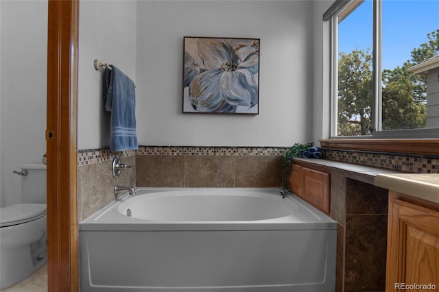 17018 Carr Ave, Parker, CO 80134 - bathroom featuring a garden tub, plenty of natural light, and toilet