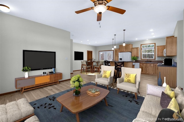 12730 Porcupine Ln, Colorado Springs, CO 80908 - living room featuring plenty of natural light, light wood-style floors, a ceiling fan, recessed lighting, and baseboards