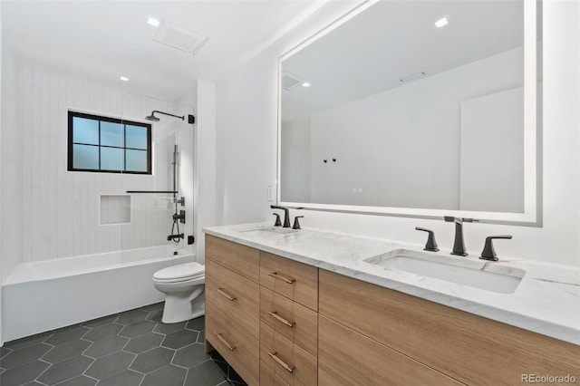 full bathroom with tile patterned flooring, toilet, shower / tub combination, and a sink