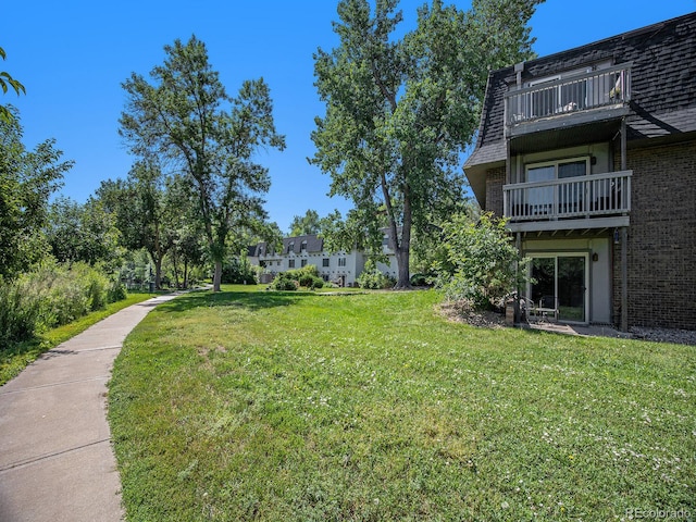 309 E Highline Cir Unit 104, Centennial, CO 80122 - view of grassy yard featuring a balcony