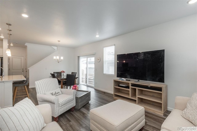 3365 N Coolidge Way, Aurora, CO 80019 - living room with a chandelier, dark wood-style flooring, baseboards, and recessed lighting