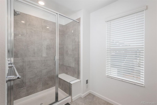 3365 N Coolidge Way, Aurora, CO 80019 - bathroom with a stall shower, baseboards, and tile patterned flooring