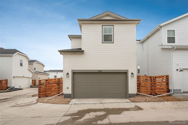 3365 N Coolidge Way, Aurora, CO 80019 - traditional-style home featuring an attached garage and concrete driveway
