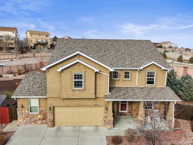 3677 Reindeer Cir, Colorado Springs, CO 80922 - traditional-style house with stone siding, stucco siding, and roof with shingles