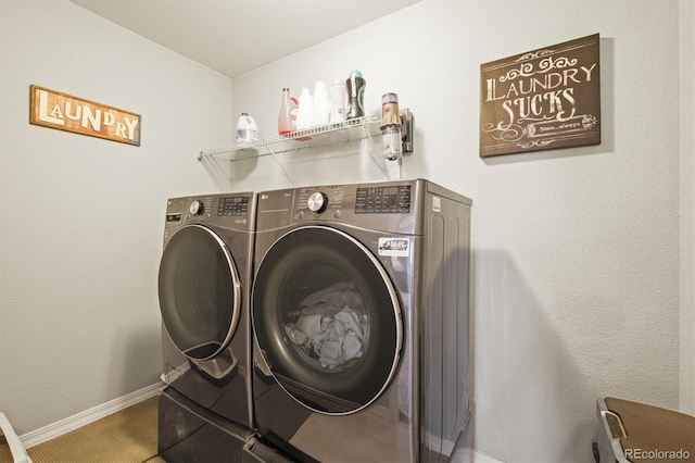 3677 Reindeer Cir, Colorado Springs, CO 80922 - washroom featuring washing machine and dryer and baseboards