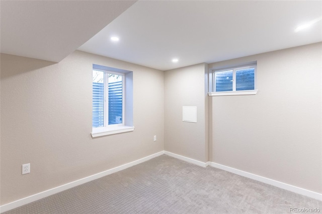 below grade area with recessed lighting, carpet flooring, and baseboards