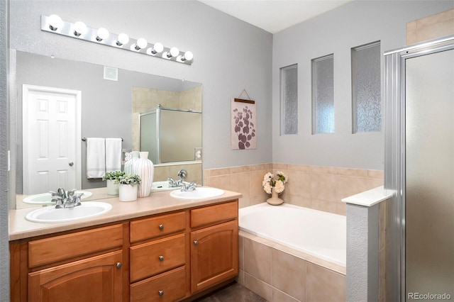 bathroom with plus walk in shower and vanity