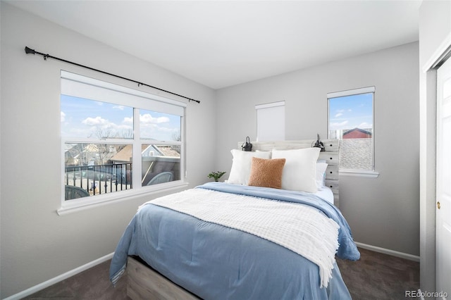 bedroom with dark colored carpet