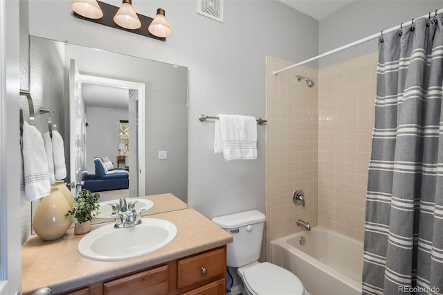 full bathroom with vanity, toilet, and shower / bath combo with shower curtain