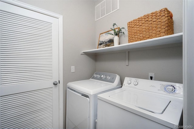 laundry room with washing machine and dryer